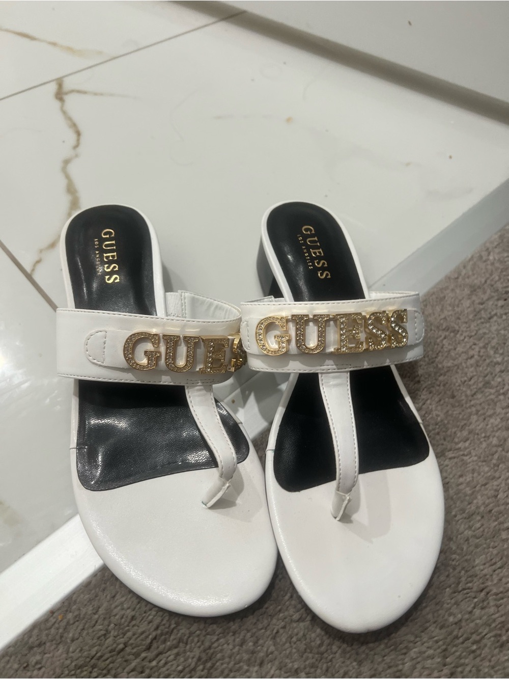 GUESS White and Black Logo Toe-Post Sandals with Gold Accents